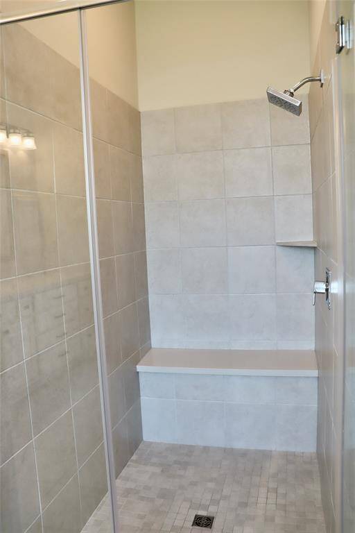 Oversized walk in shower in the primary bedroom