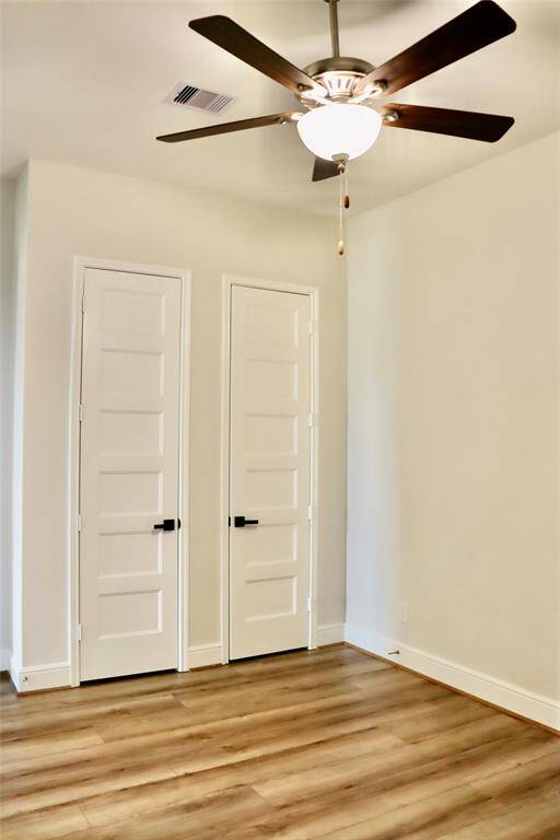 1 of the 2 bedrooms that are connected by a jack and Jill with double closet