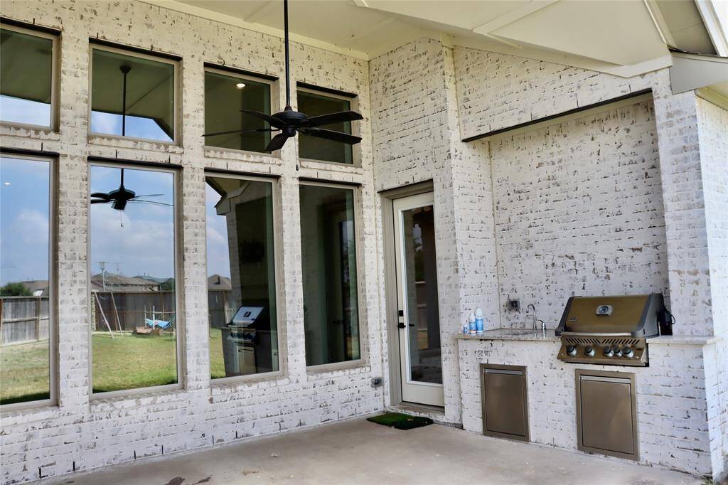 Large covered patio complete with outdoor kitchen