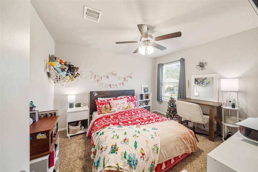 Another secondary bedroom loaded with furniture.  These secondary bedrooms are large and roomy and can potentially house many items.