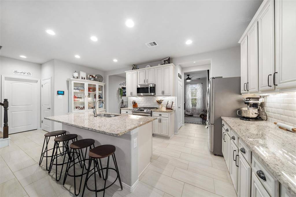 Beautiful open kitchen with SS appliances. So much room for entertaining.