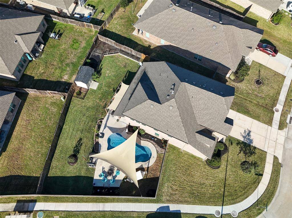Look how large this pie shaped yard is bordered by a sidewalk.