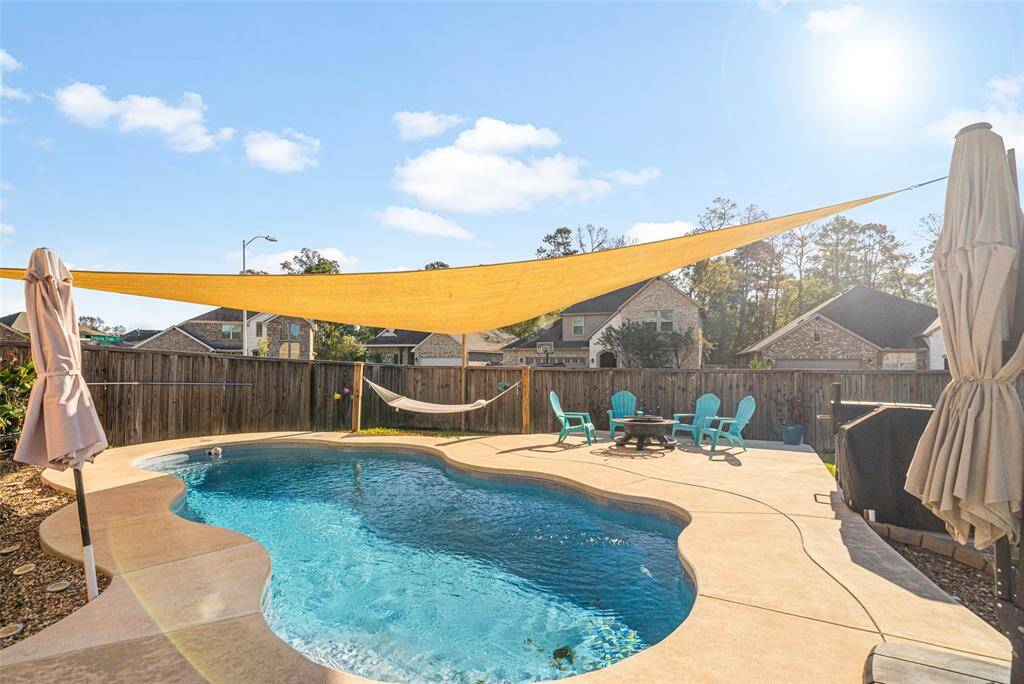 Look at all the entertaining deck space here.   This is great use of the yard.