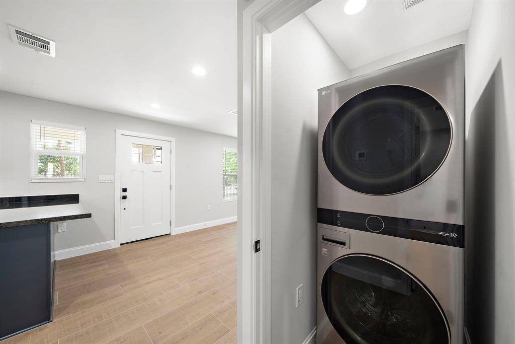 This stacking Washer/Dryer unit is tucked in a closet just off the kitchen. Never been used!