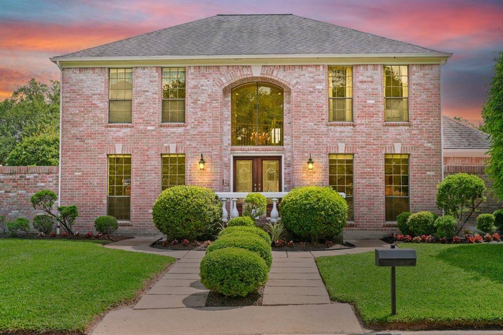 This stately home sits on an oversized lot in the desirable master planned community Sugar Creek.