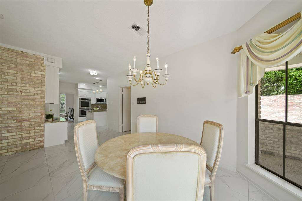 There are nice features, such as the exposed brick wall, throughout this home.