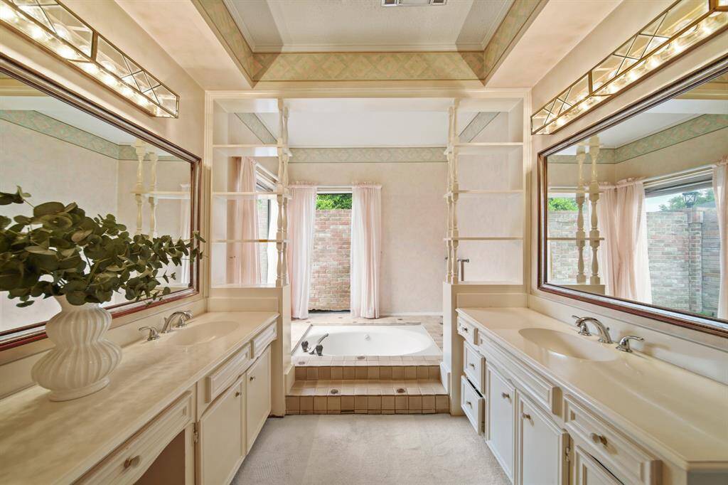 The primary bath has "good bones" and is just waiting to be re-imagined by the next owner!