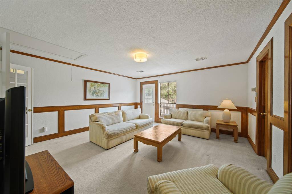 The upstairs game room is large and has a door leading to a balcony. This room provides great flex space and would work well as an additional living/TV space, a kid's toy room, gaming room or whatever suits your family's needs.