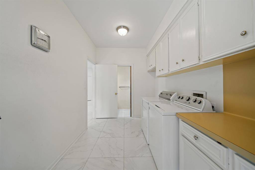 The laundry room also has a half bath.