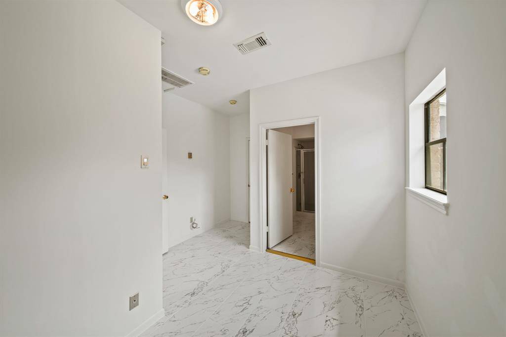 This room is located adjacent to the detached garage can be used for many things...guest quarters, a "nanny/granny" suite, a Mother-in-Law suite...so many possibilities. It could also be opened to the backyard and would be a fabulous cabana room, off the pool area.