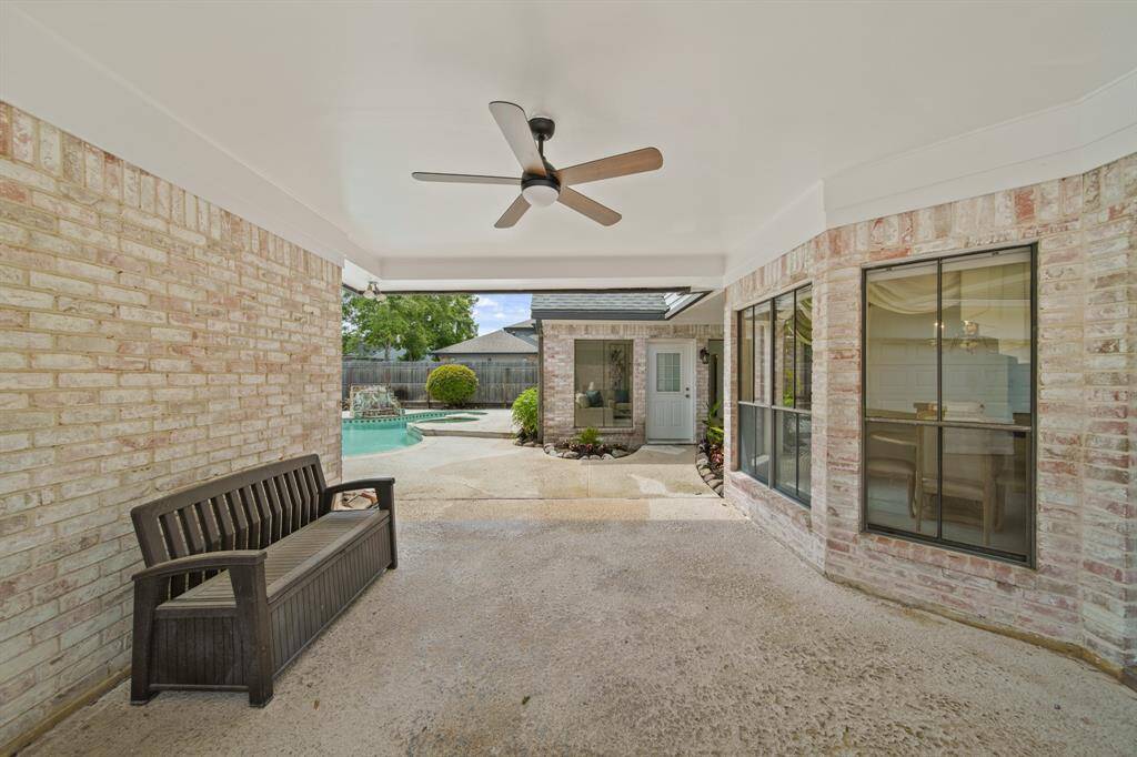 The backyard has so many possibilities...the large covered patio provides some relief from the heat.