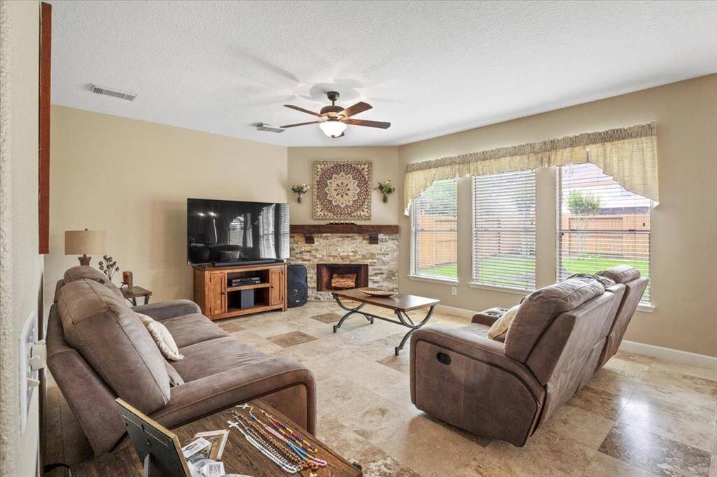 Familyroom with beautiful fireplace.