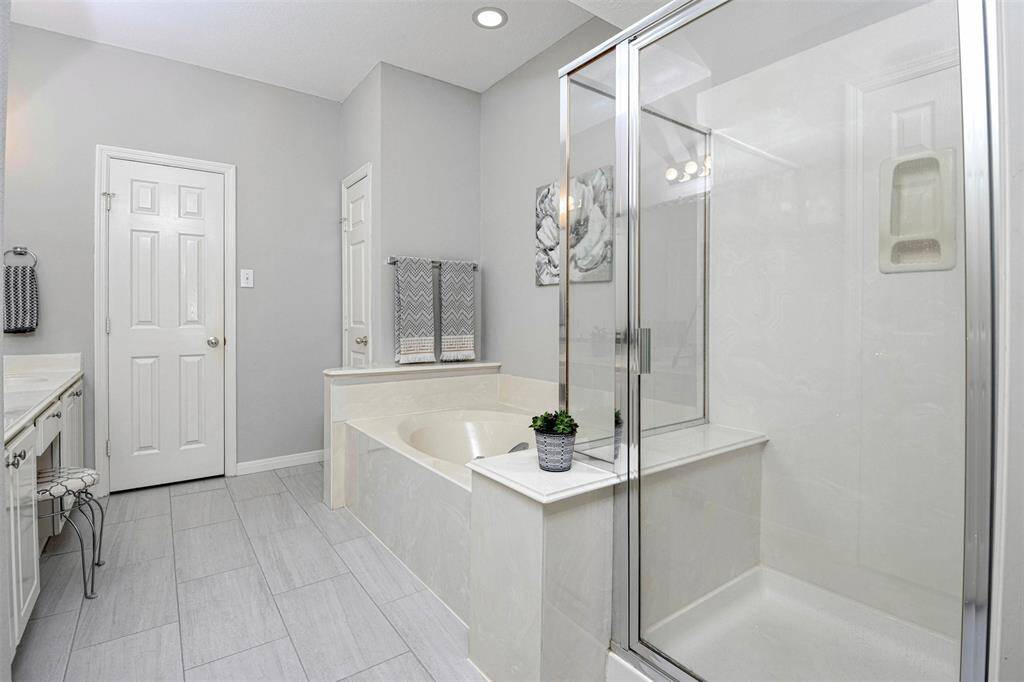 Primary bathroom is spacious with a separate garden tub