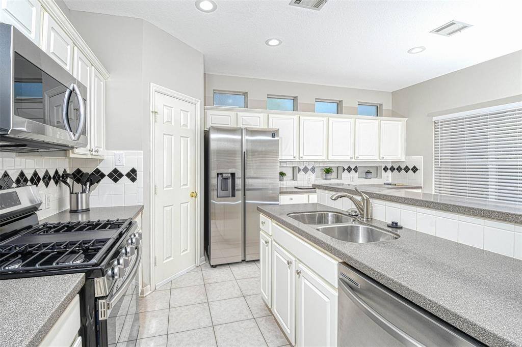 New faucet and lovely quartz counter tops. Brand new 5 burner gas stove and oven.