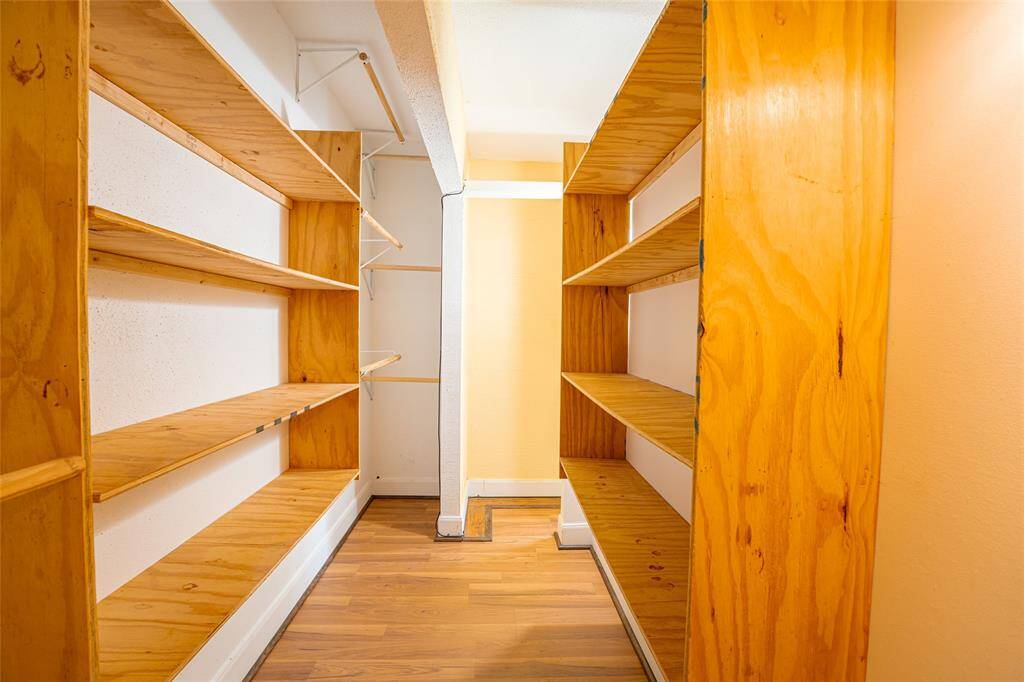 Walk in closets with plenty of storage spaces.