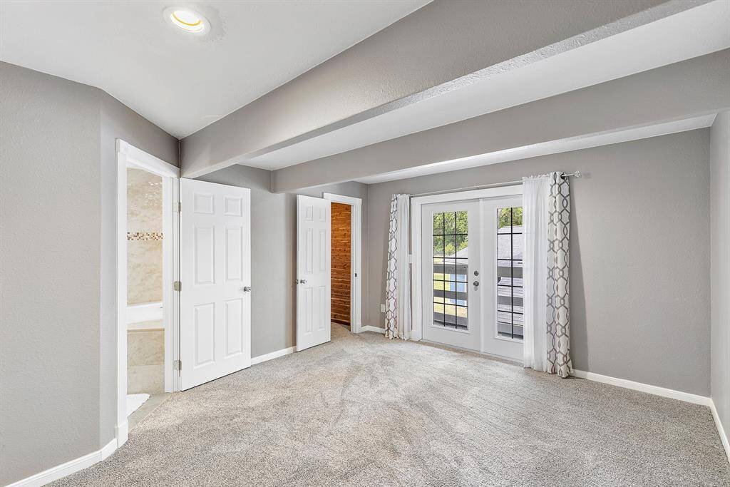 This is the alternate secondary bedroom upstairs with fresh paint and carpet as well as a recently updated bath!