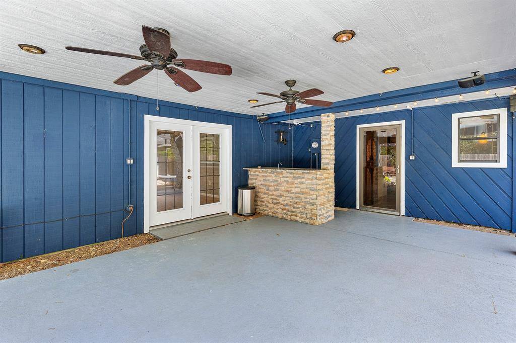 The covered patio is an entertainer’s dream, thoughtfully equipped with ceiling fans, recessed lighting, and pre-wiring for sound to set the perfect mood. A sleek granite wet bar area with a built-in fridge makes outdoor hosting effortless—ideal for everything from summer cookouts to evening cocktails under the stars.