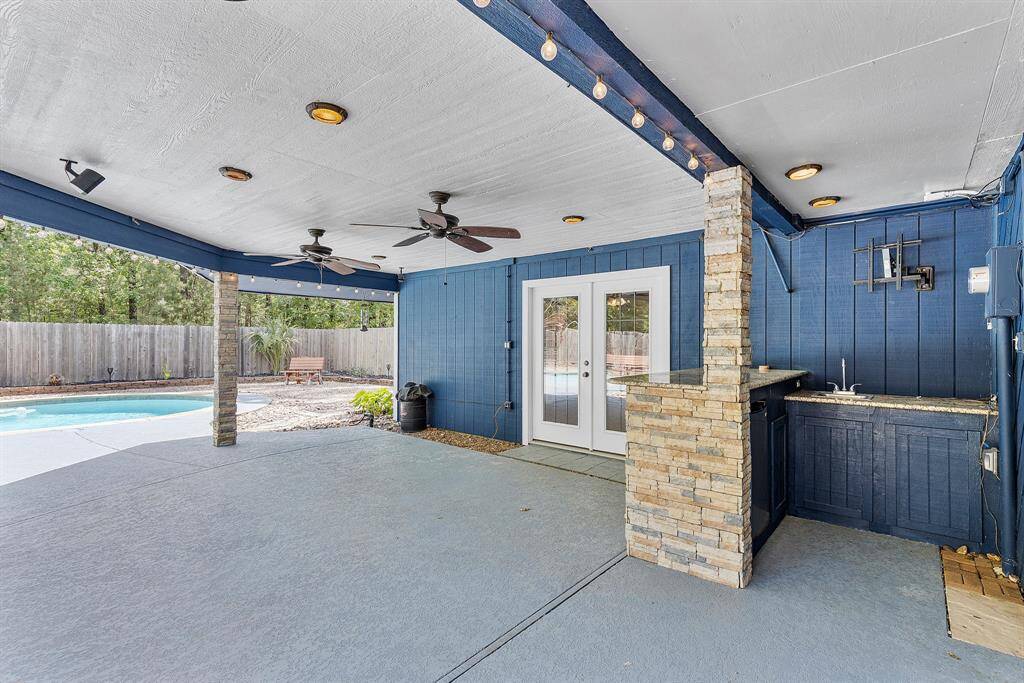 Enjoy year-round outdoor living on the expansive covered patio overlooking the sparkling pool—perfect for relaxing in the shade, dining al fresco, or hosting unforgettable gatherings. This seamless connection between indoor comfort and outdoor luxury makes entertaining a breeze.
