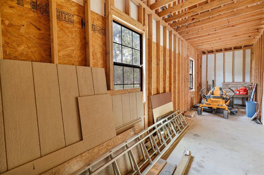 Inside the enclosed storage space of the covered parking area