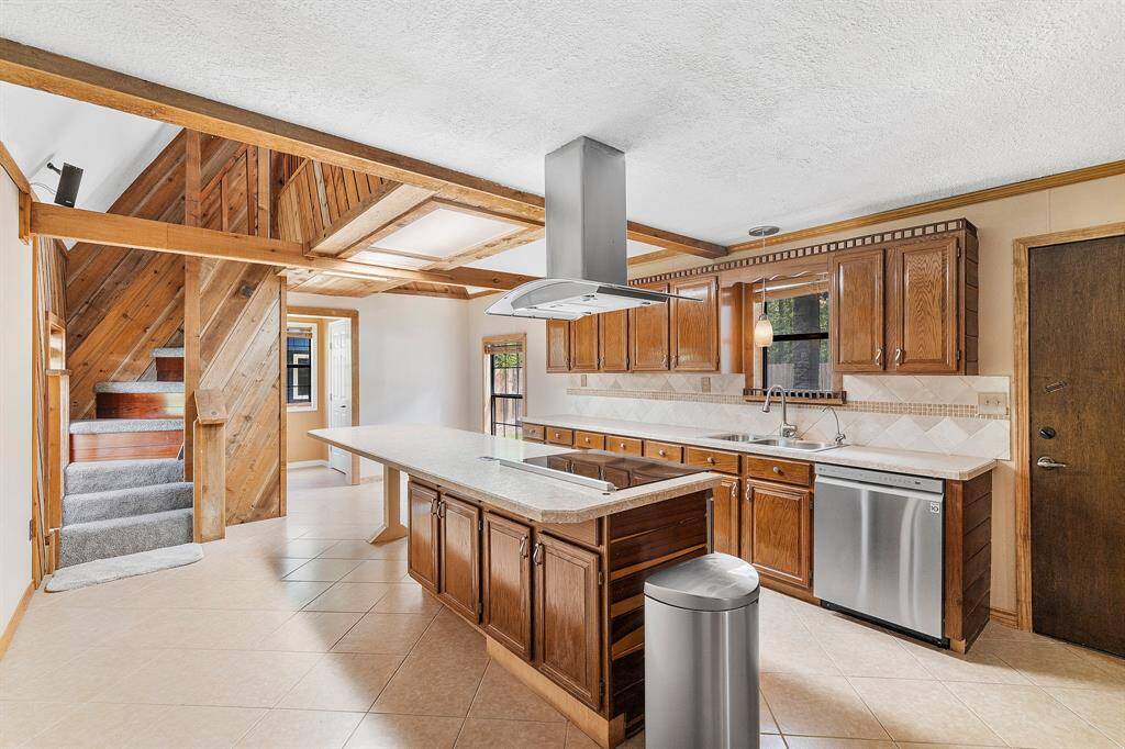 Cook, gather, and create in this beautifully designed kitchen tailored for both everyday living and entertaining. Anchored by a premium Bosch stove, this culinary space boasts a massive island—ideal for meal prep, casual dining, or hosting guests. You'll love the abundance of cabinet and counter space, offering both style and storage in equal measure. A spacious walk-in pantry keeps everything organized and within reach!