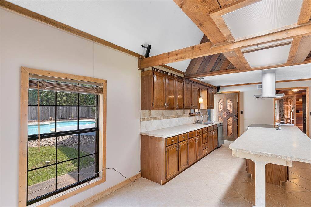 The charming breakfast nook to start your day with sunlit mornings overlooking the pool!
