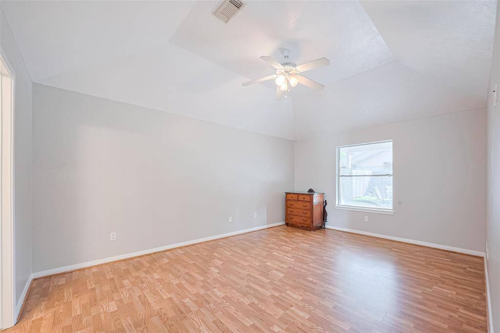 Good-sized primary suite with no carpet—clean, cozy, and comfortable.