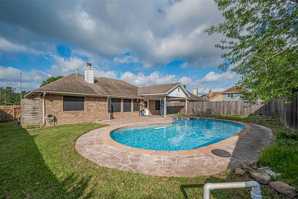 Covered patio area, perfect for outdoor dining, grilling, or just lounging in the shade.