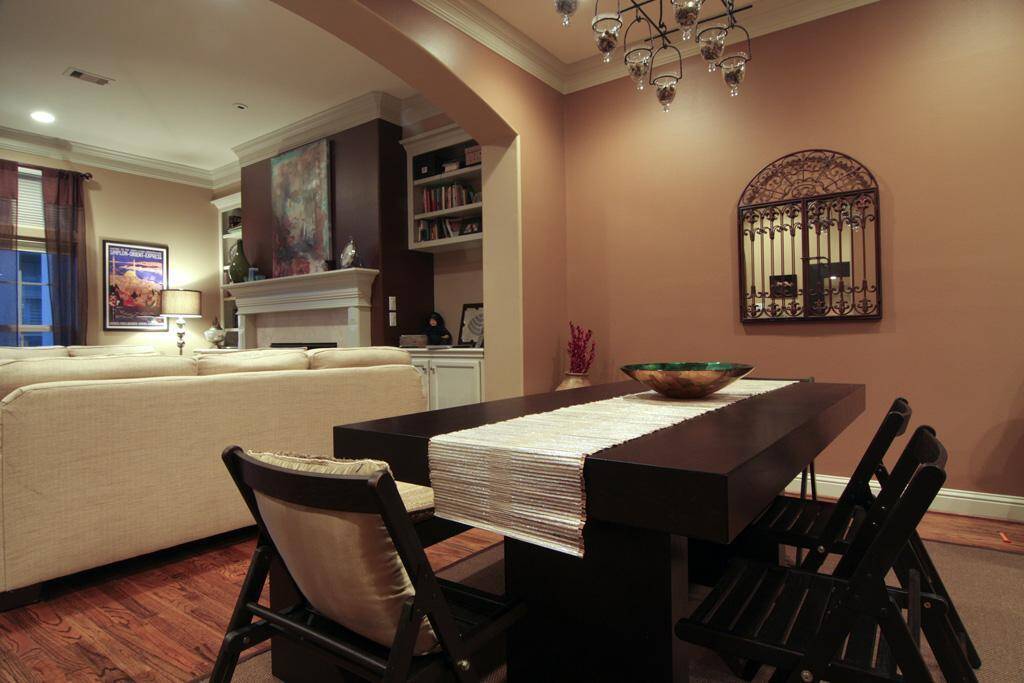 Dining room with arch openings leading to the living room