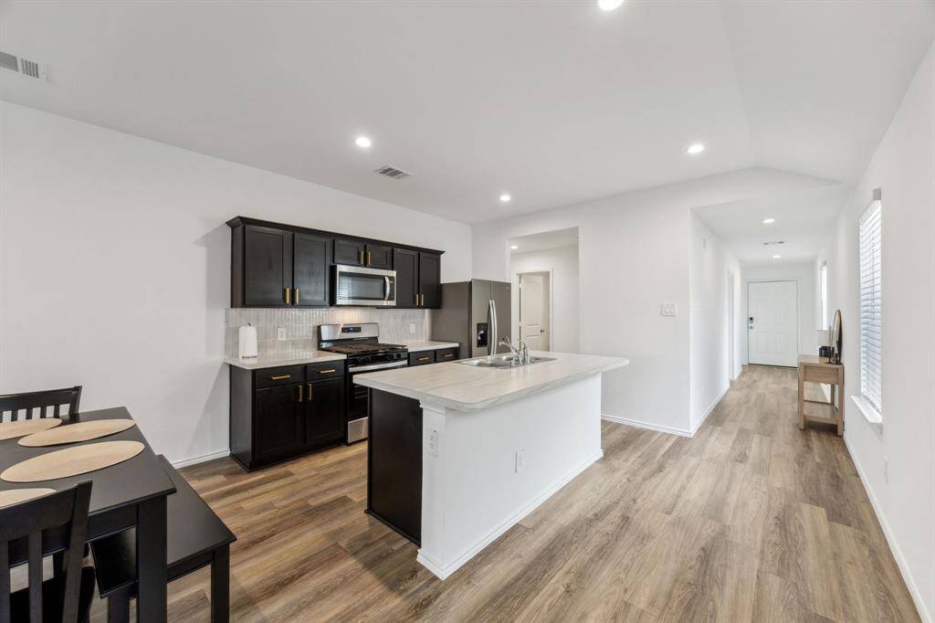 Another view of the Kitchen and the entry way.