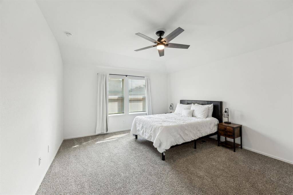 Primary Bedroom. This room features high ceilings and plenty of natural light.