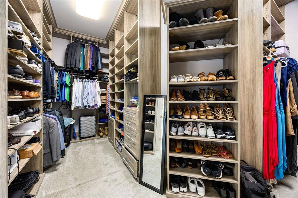 Huge walk-in closet in primary suite with plenty of storage and shelf space