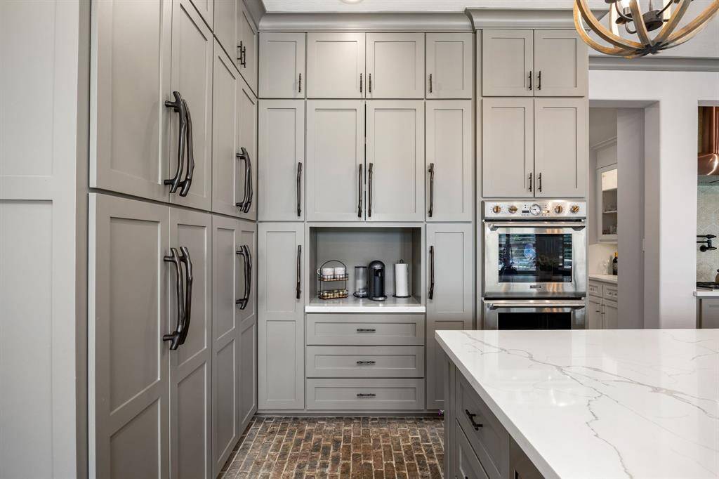a wall of cabinets to the ceiling! and a small space to set up your daily coffee or tea
