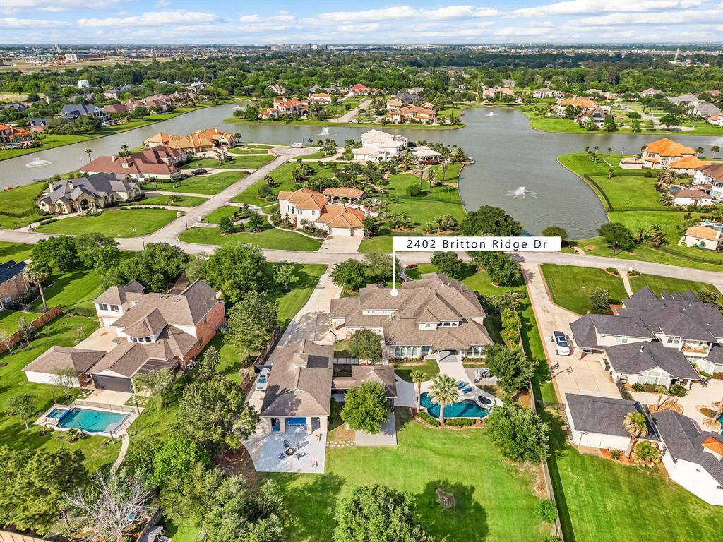 Aerial view of home with lake view front your own front yard or juliet balcony