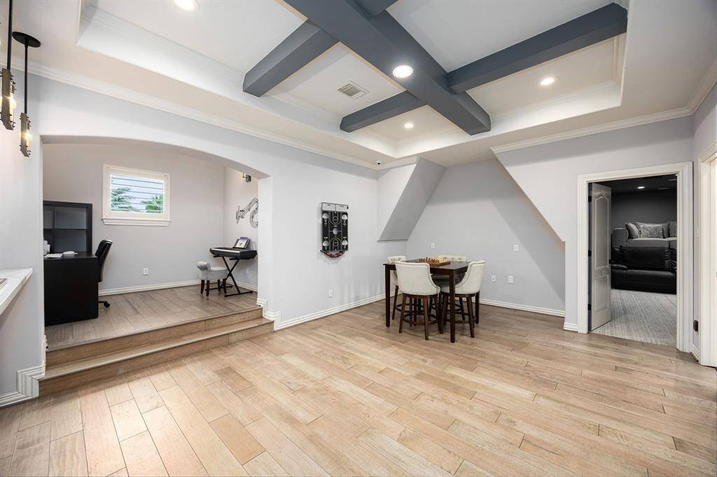 Entertainment room with hardwood floors and small den for a second level office or hobby