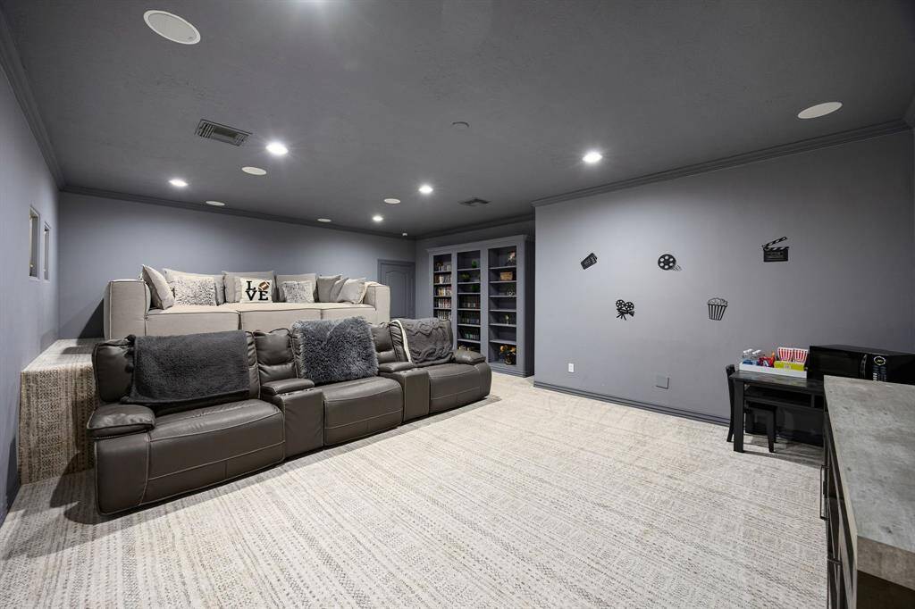 Across from entertainment room, you walk into the media room with two levels to watch your favorite movies and shows uninterrupted