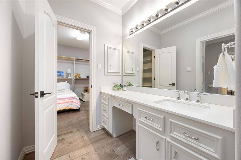 Large ensuite bathroom of secondary guest suite with a walk-in close big enough to fit a bed for fun nights!