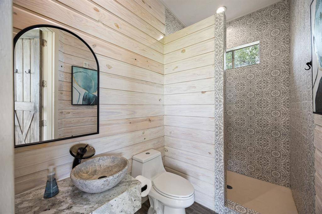 Exterior bathroom with access to pool