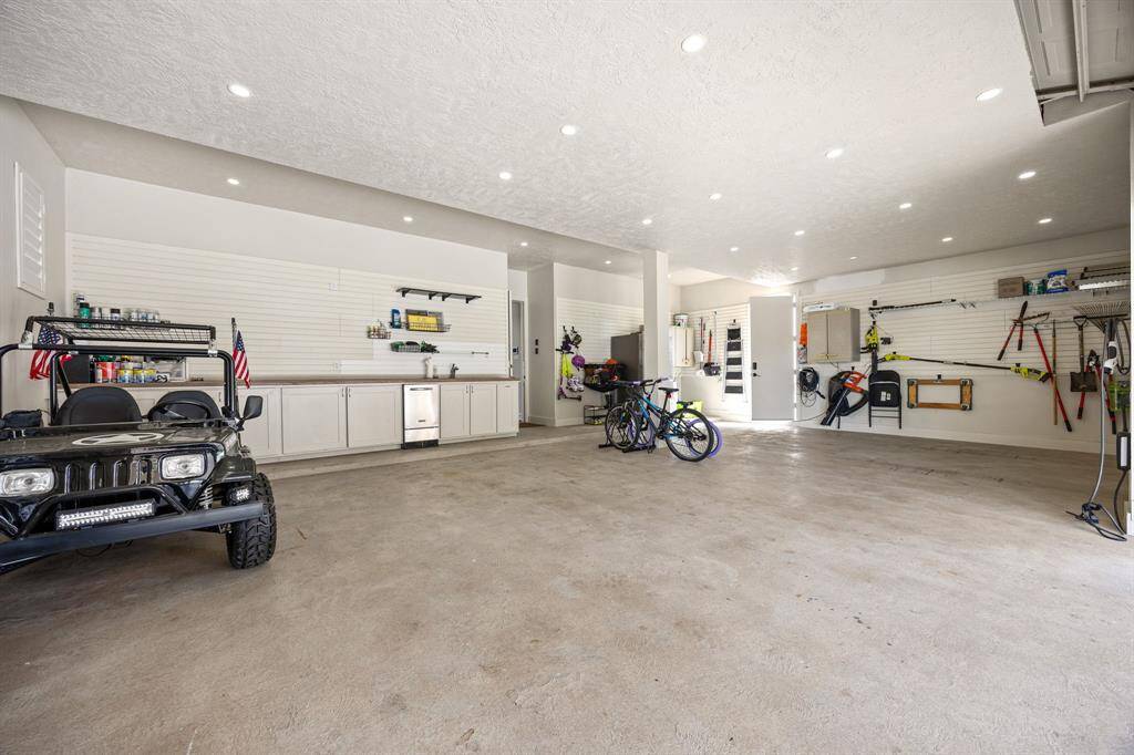 3-car attached garage with storage and closet space