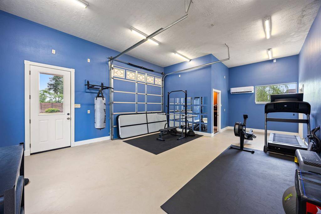 Converted 3-car garage used as a gym and guest suite