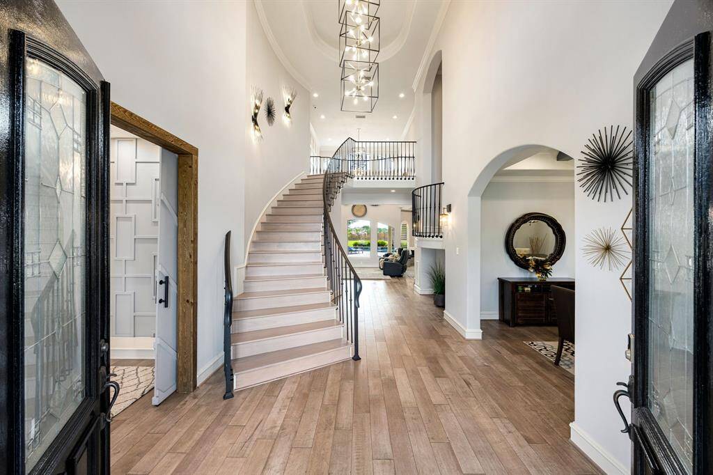 Enter into the foyer and be greeted by spacious high ceilings