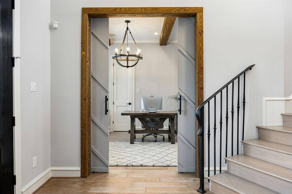Office enclosed behind paneled doors, a very unique feature