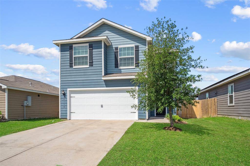 New garage door, new grass and landscaping