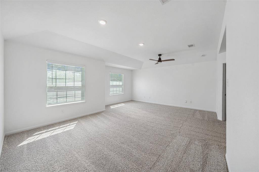 Primary bedroom is huge. Room for a king size bed and a couch or sitting area.