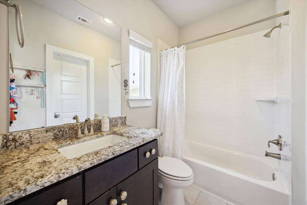 Third bath with shower/tub combo.