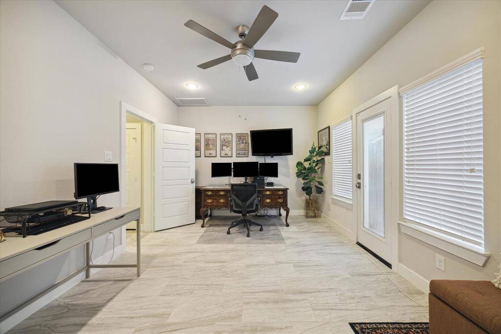 First bedrom on the first floor has a door to the backyard and plenty of windows for natural lights.