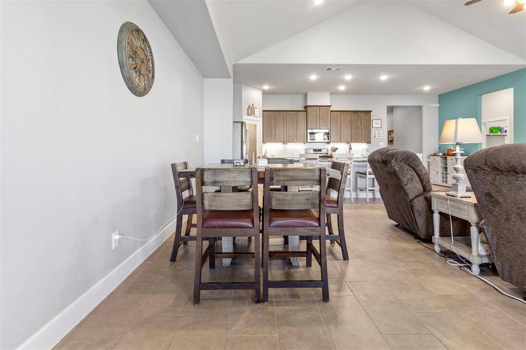 This dining area has tile floors and is right off the kitchen.
