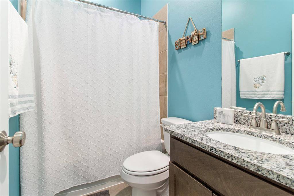 Secondary bathroom features atub/shower combo and vanitywith plenty of counter space.