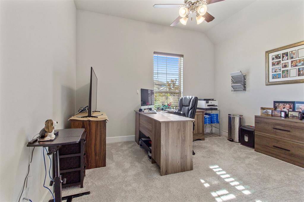 Third bedroom features awindow and plush carpet.
