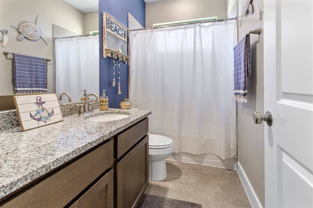 Third bathroom features atub/shower combo and long vanitywith plenty of counter space.