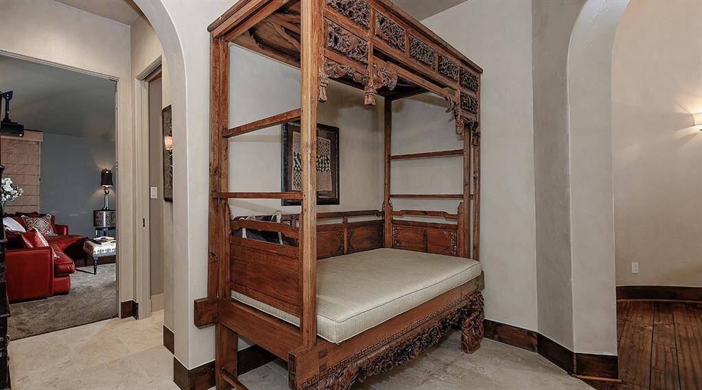 The media room with full bathroom and this space where the bed is shown could be the 4th ensuite.